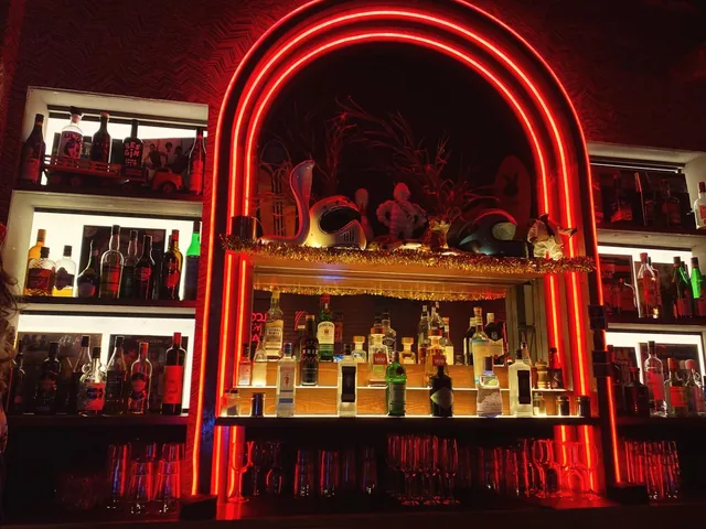 A neon arch over a bar