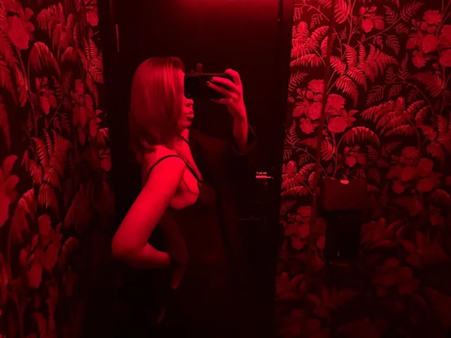 In a red mirror, lipstick cherry all over