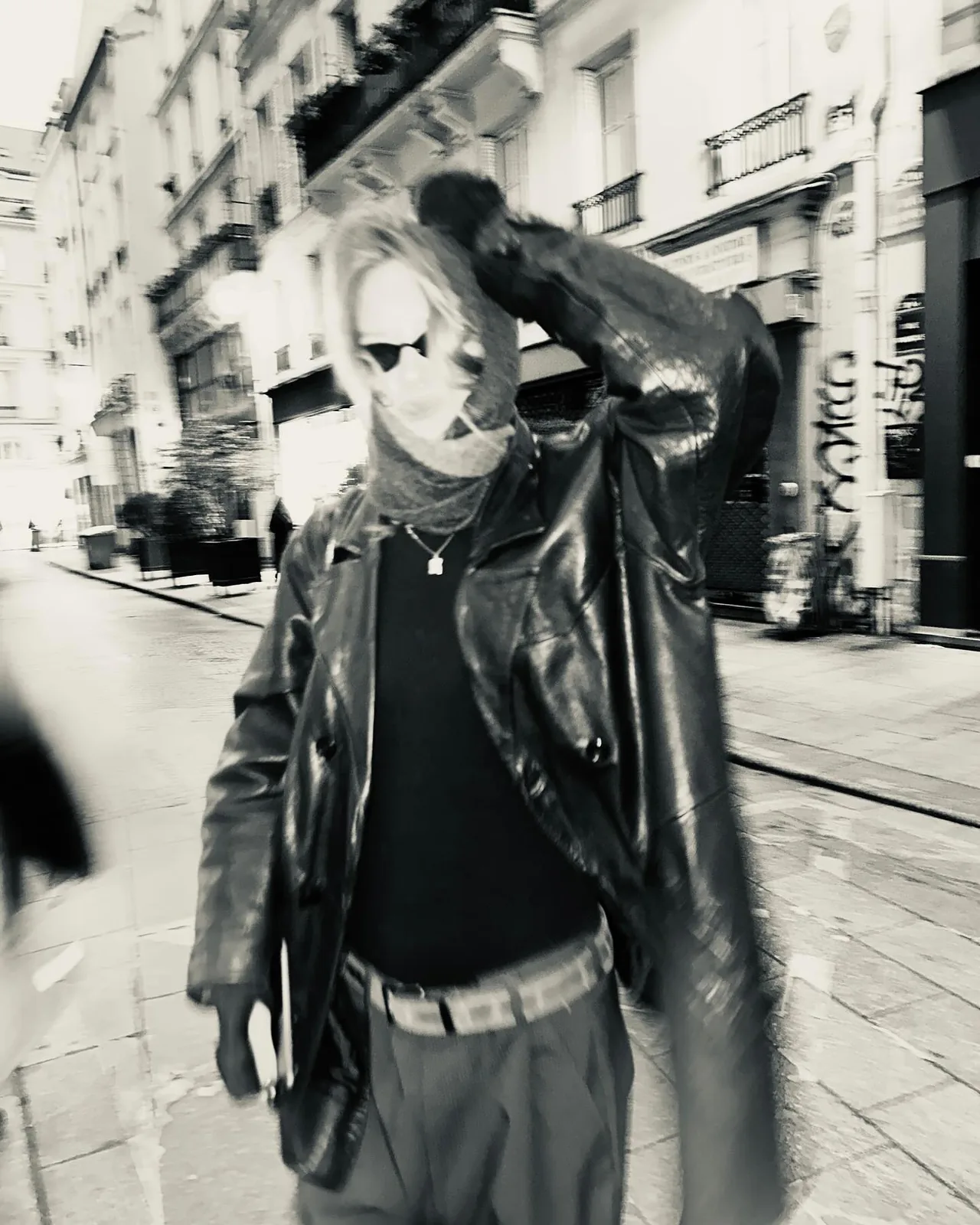 sofia in a leather jacket in a Paris street, black and white