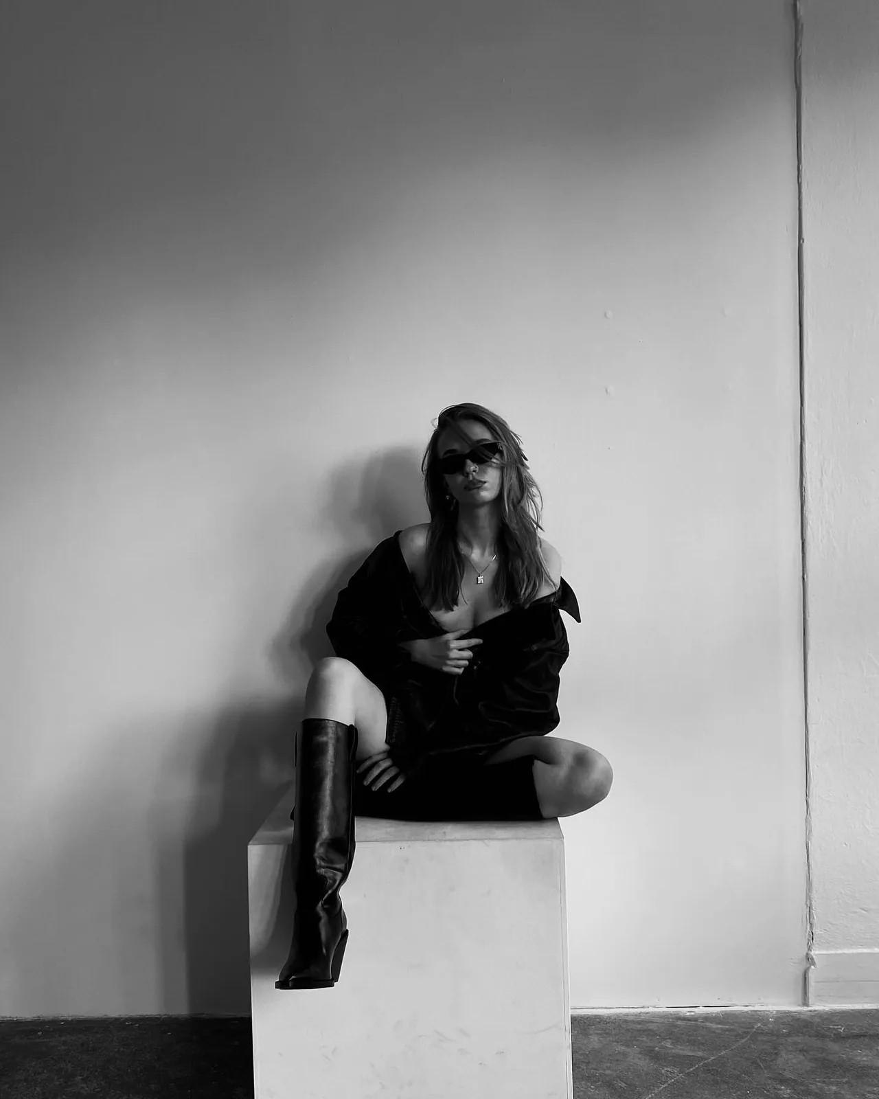 Studio, boots on a white cube