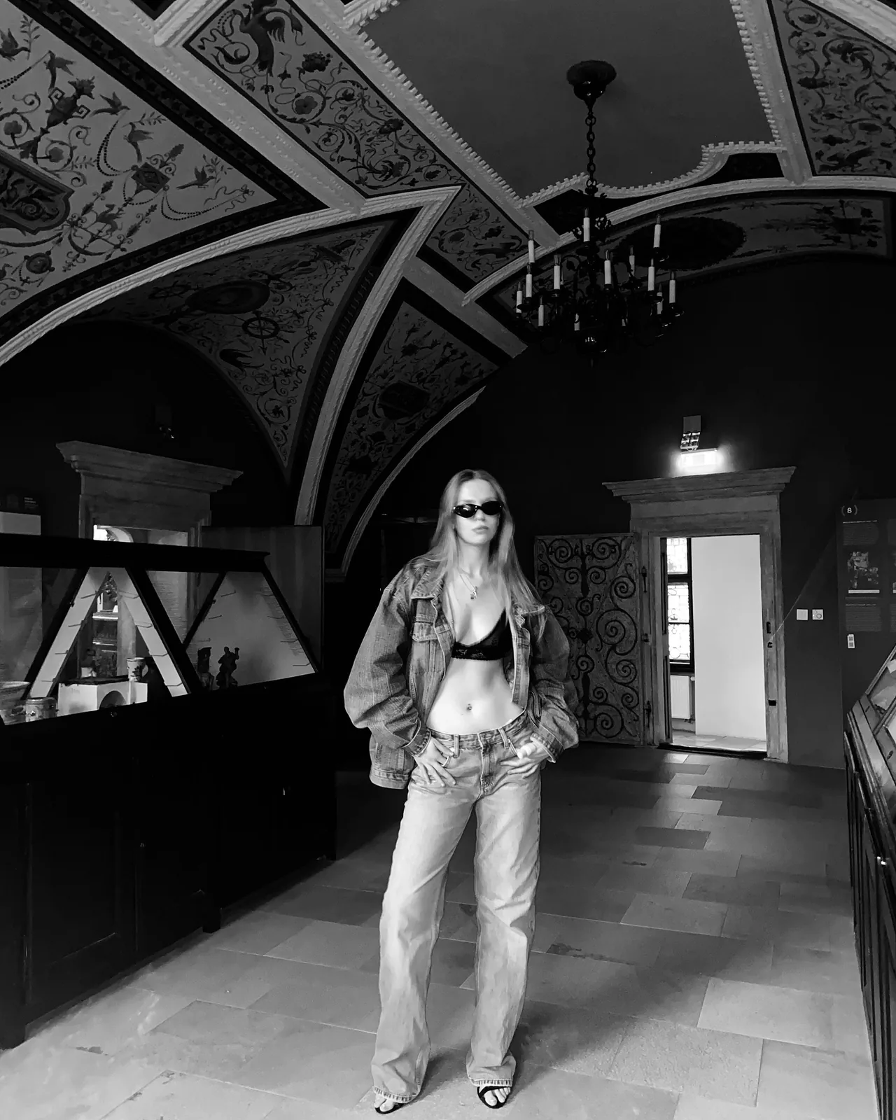 Denim jacket in a painted palace hall
